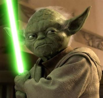 A fierce picture of Yoda holding his green light sabre